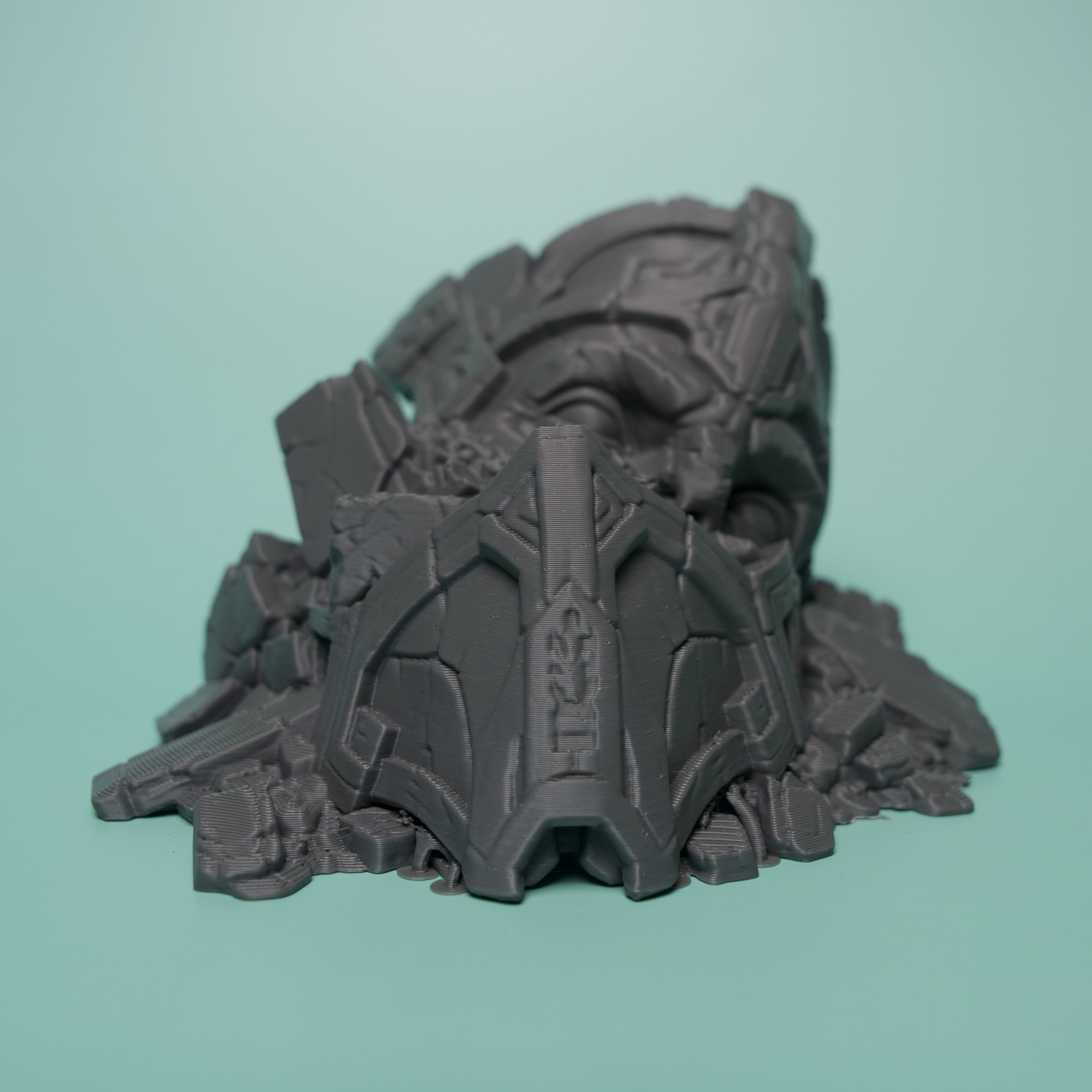 Actual unpainted fallen sci-fi statue head terrain
